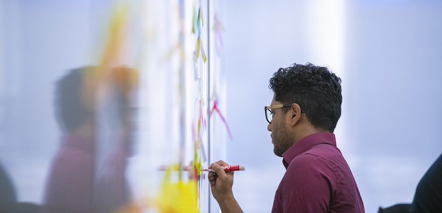 Man writing on whiteboard