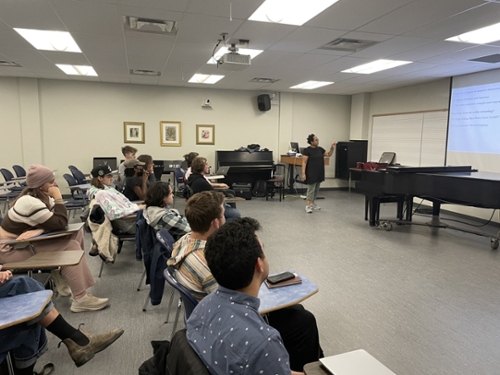 Photo of Penelope working with students