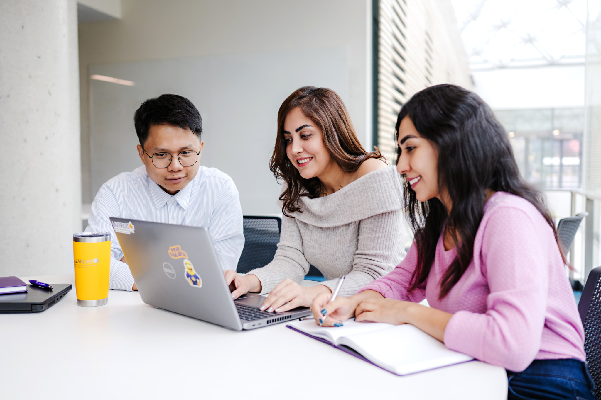 MSc in Management students working together at a table