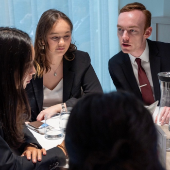 Student team working around a table. 