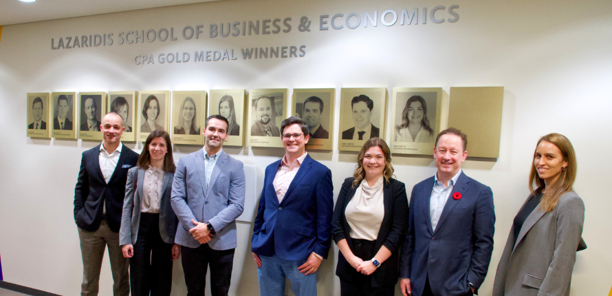 Nicole and other winners in front of CPA Gold Medal wall with Dean Murray