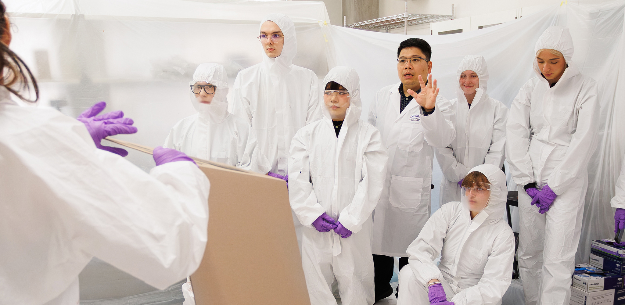 Nathan Vo and student participants in the blood spatter analysis lab