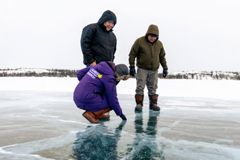 Folks investigating ice road