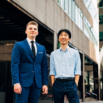 Two students in work clothes