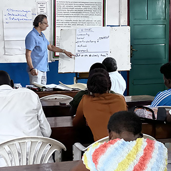 Akbar Saeed teaching in classroom