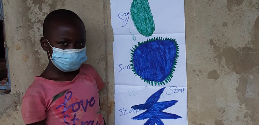 Student standing in front of artwork