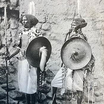 People dressed up in human zoo