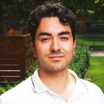 smiling student with white polo shirt